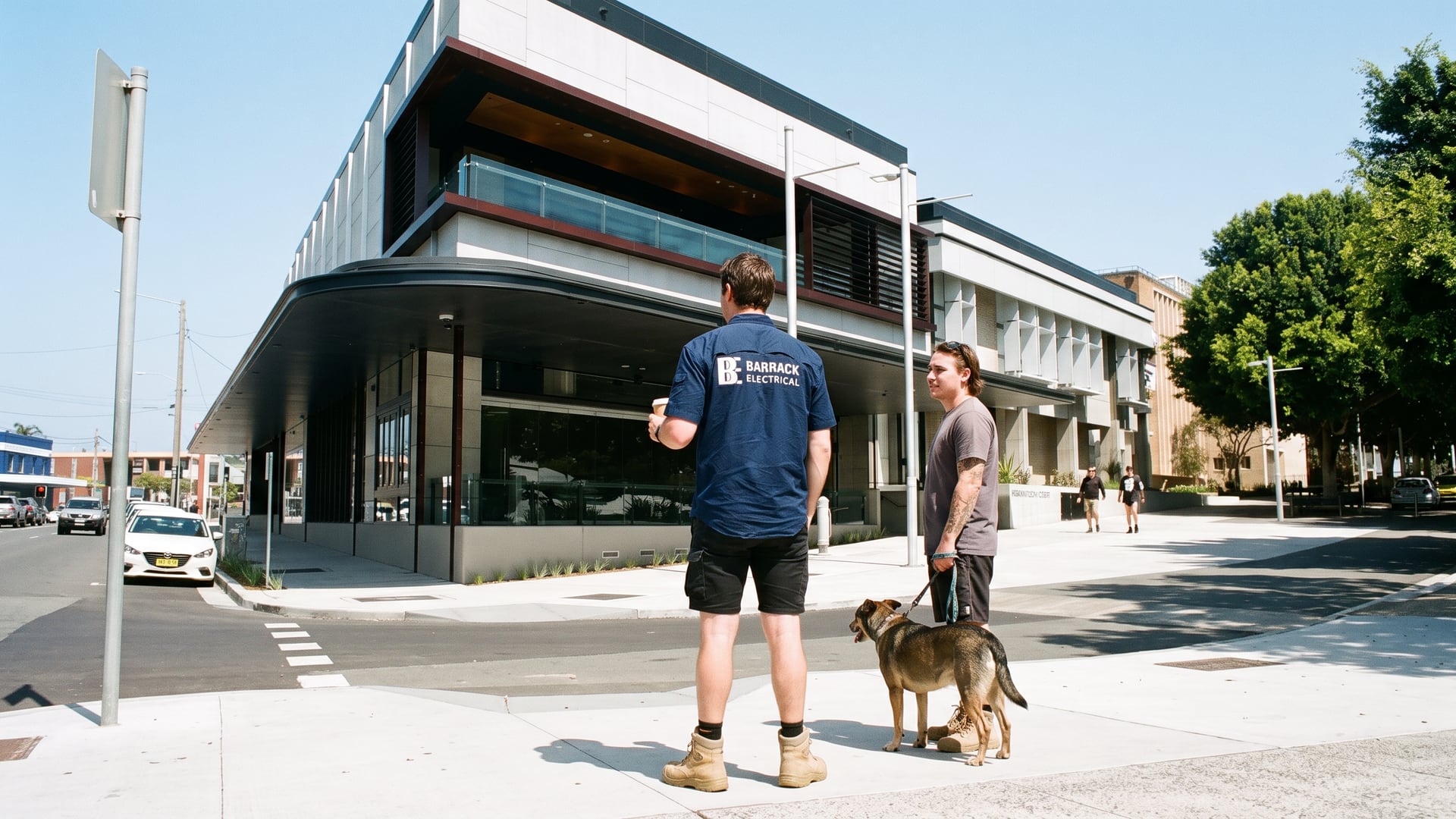 A Barrack Electrical electrician stopped to talk with a local outside the Newcastle Art Gallery on Darby Street, Cooks Hill
