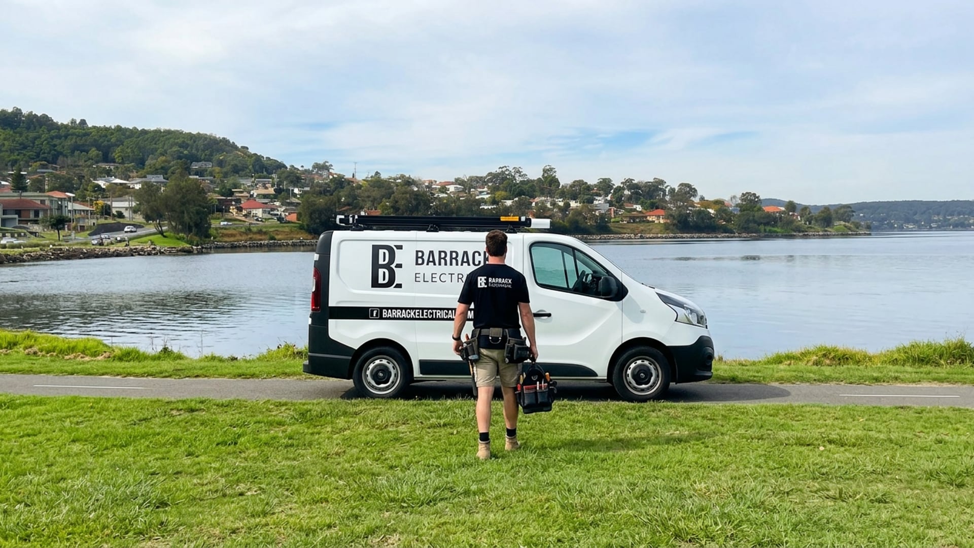 A Barrack Electrical van on the grass beside the lake at Speers Point
