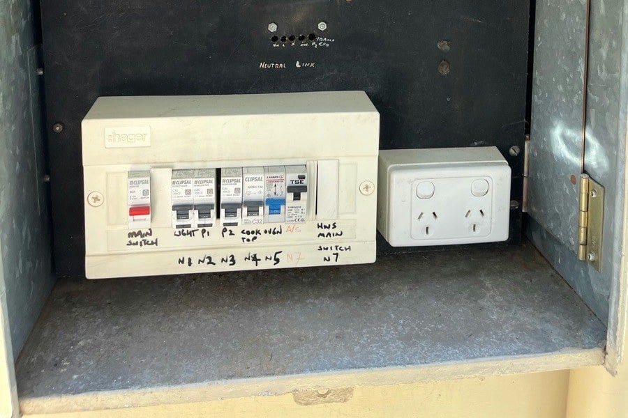 The cook top and oven circuits labelled on their own breakers in a switchboard