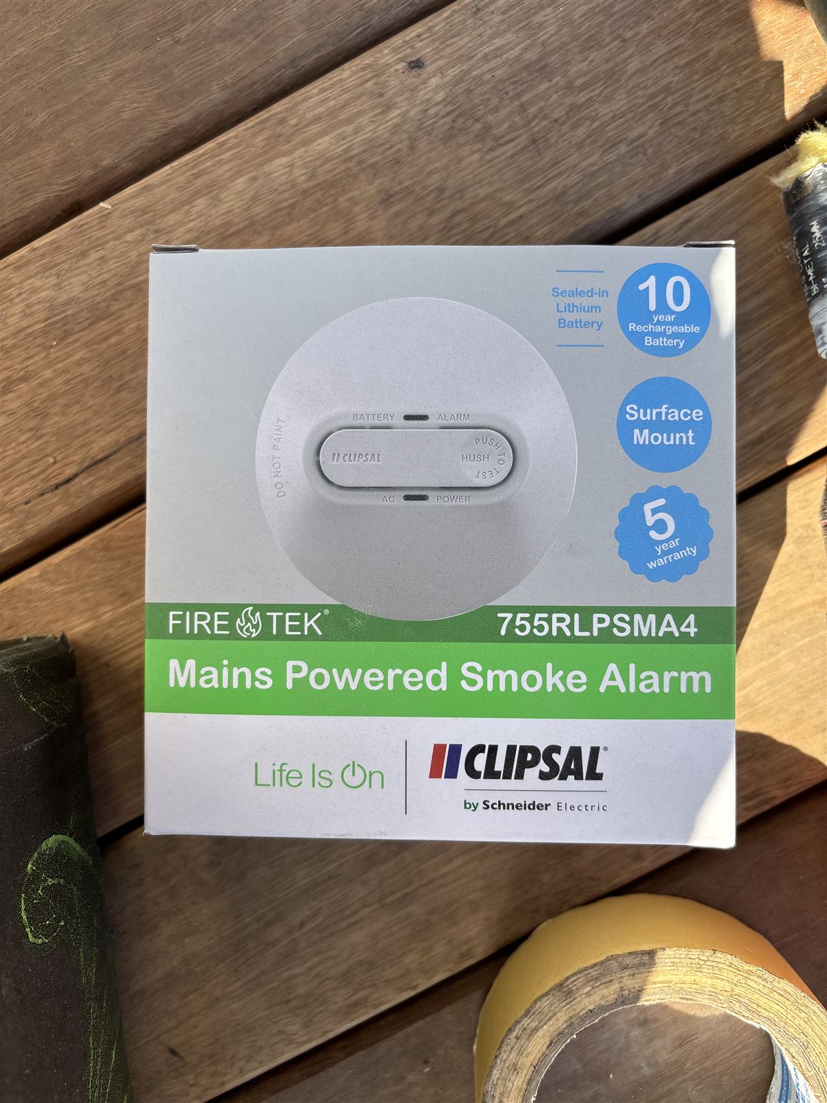 New mains-powered smoke alarm in its box, with a sealed 10-year lithium battery