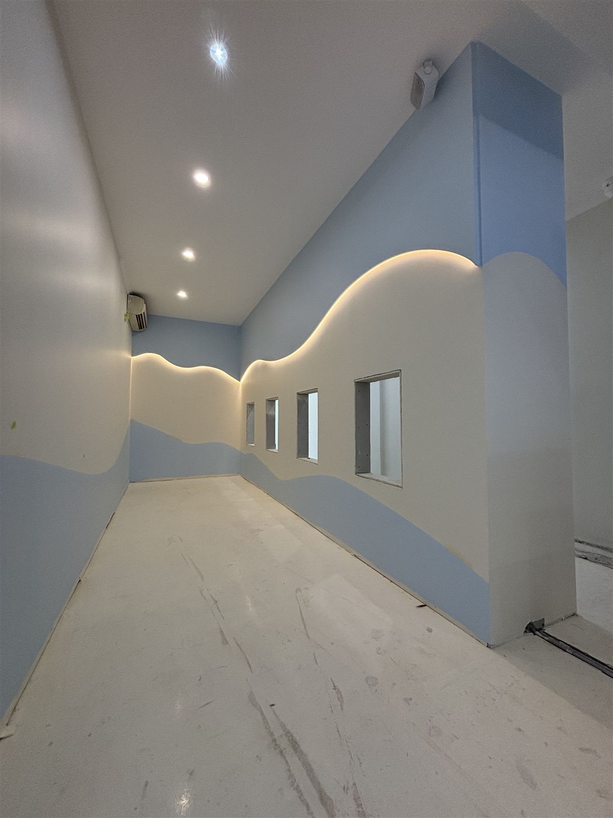 An LED strip following the curve of a wall in a commercial fit-out