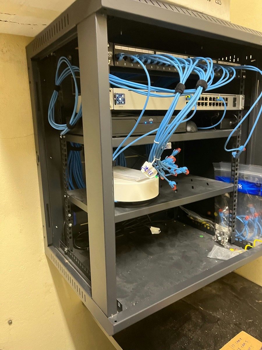 Cabling run through a wall cavity during a whole-home data job