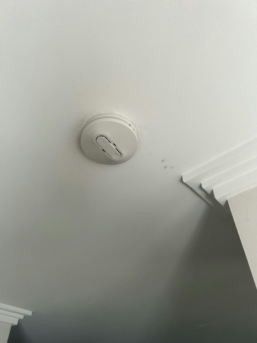 A new smoke alarm fitted to the ceiling