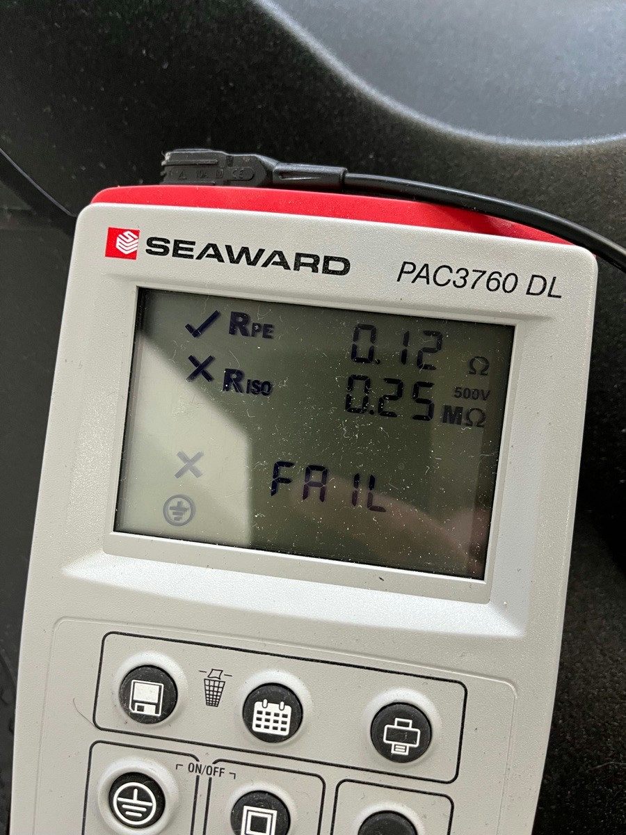 An appliance tester screen showing a failed insulation resistance result