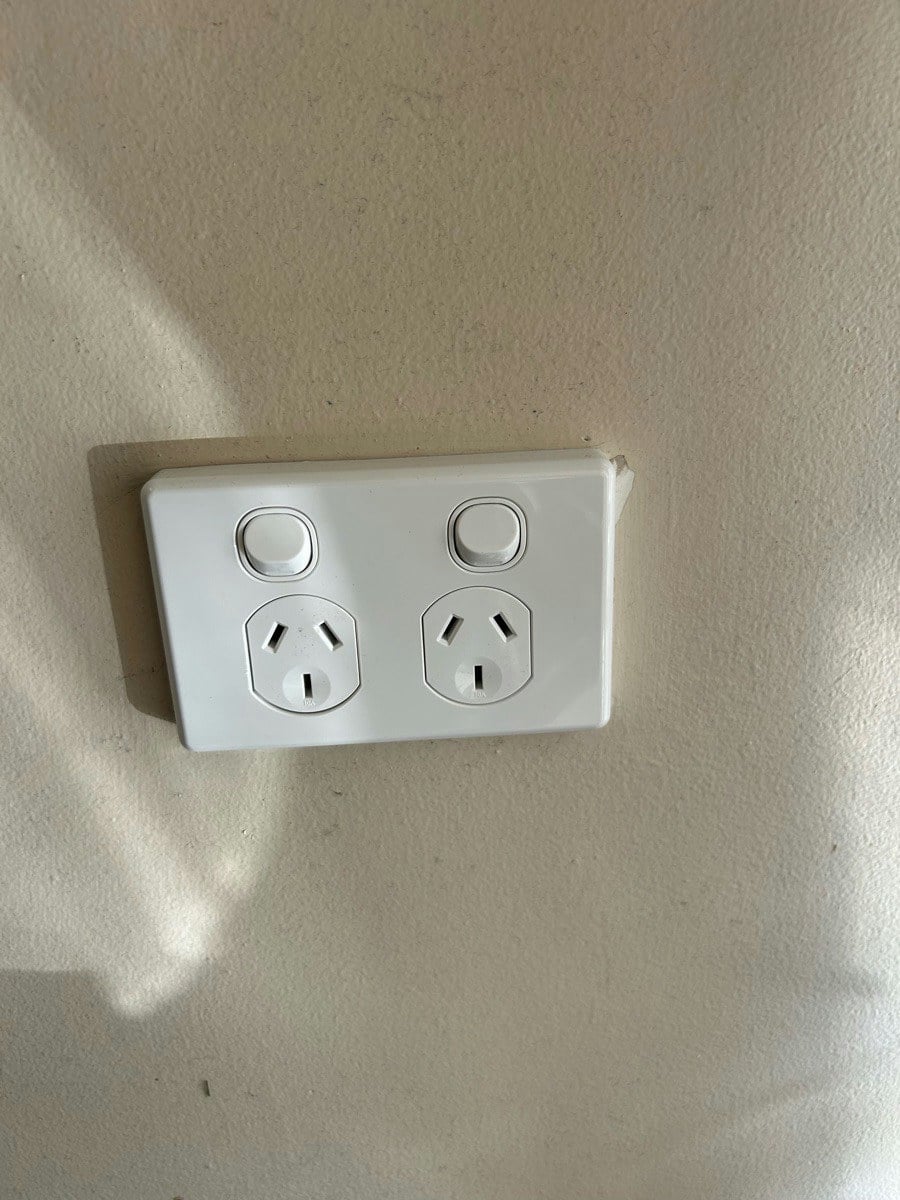 A new double power point fitted to the wall with the plate on