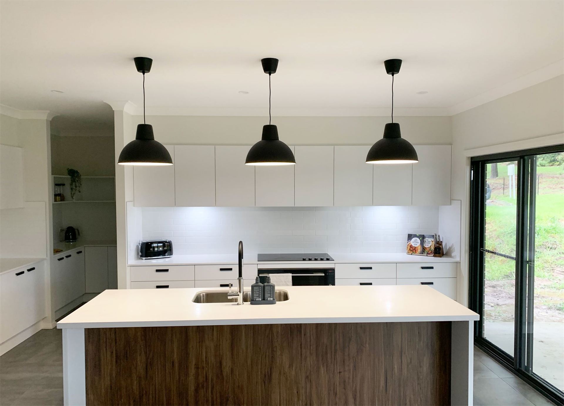 Pendant lights hanging over a kitchen island