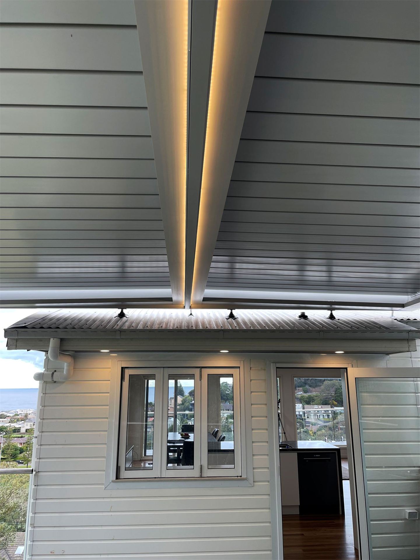 Outdoor LED floodlighting on a building at dusk
