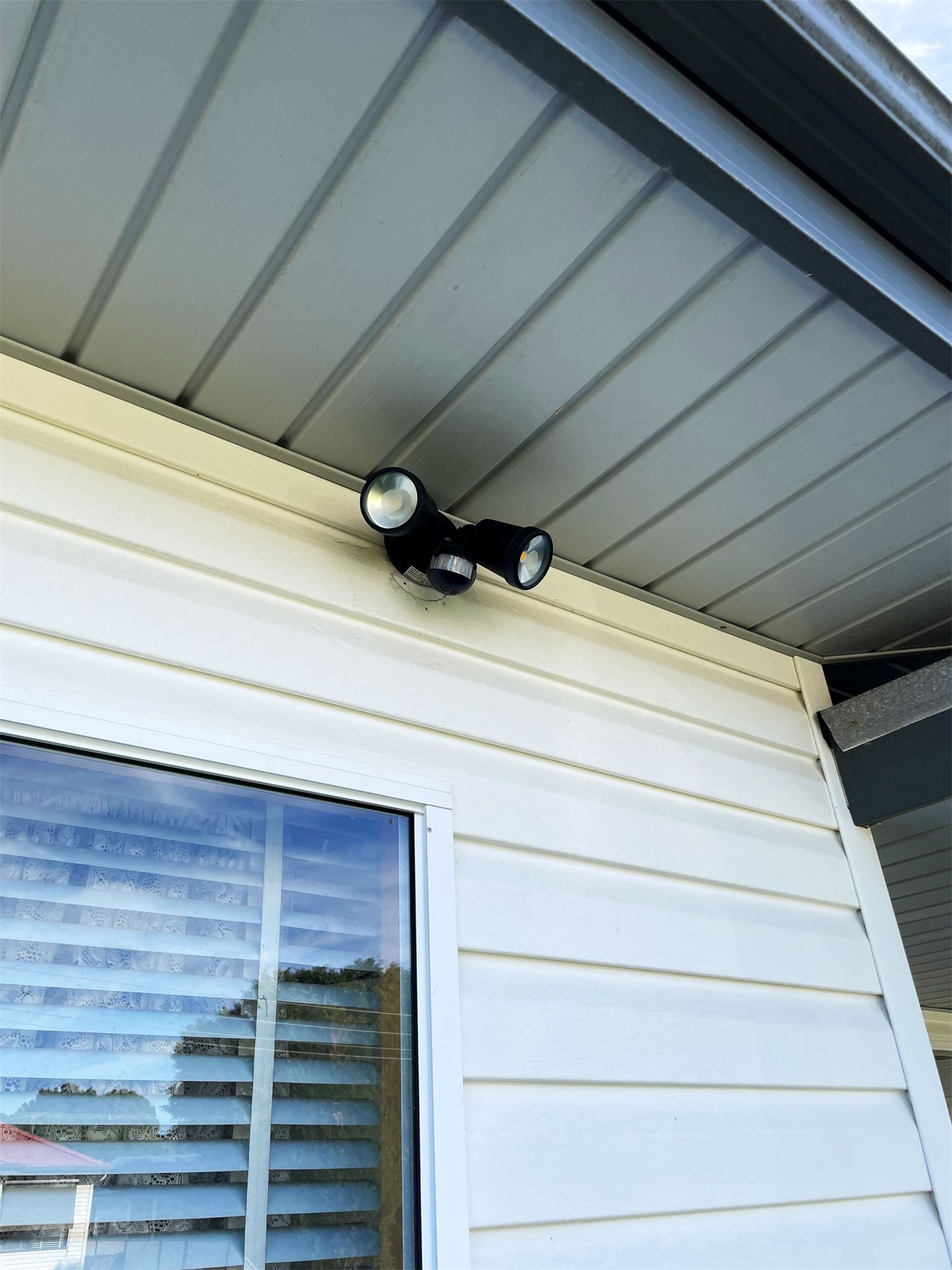 Twin sensor light fitted under a house eave